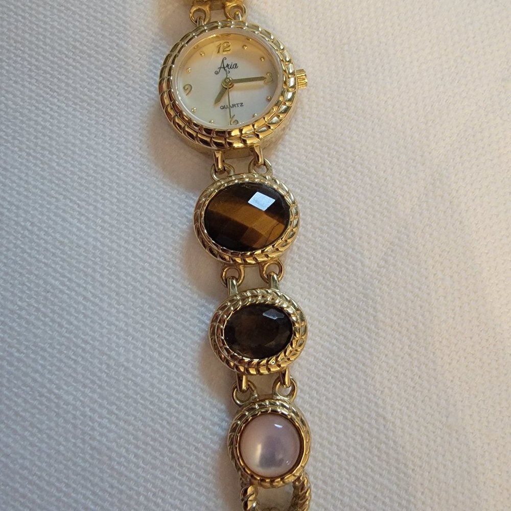 Aria Goldtone bracelet watch with tiger eye, smoky quartz and milky quartz gems